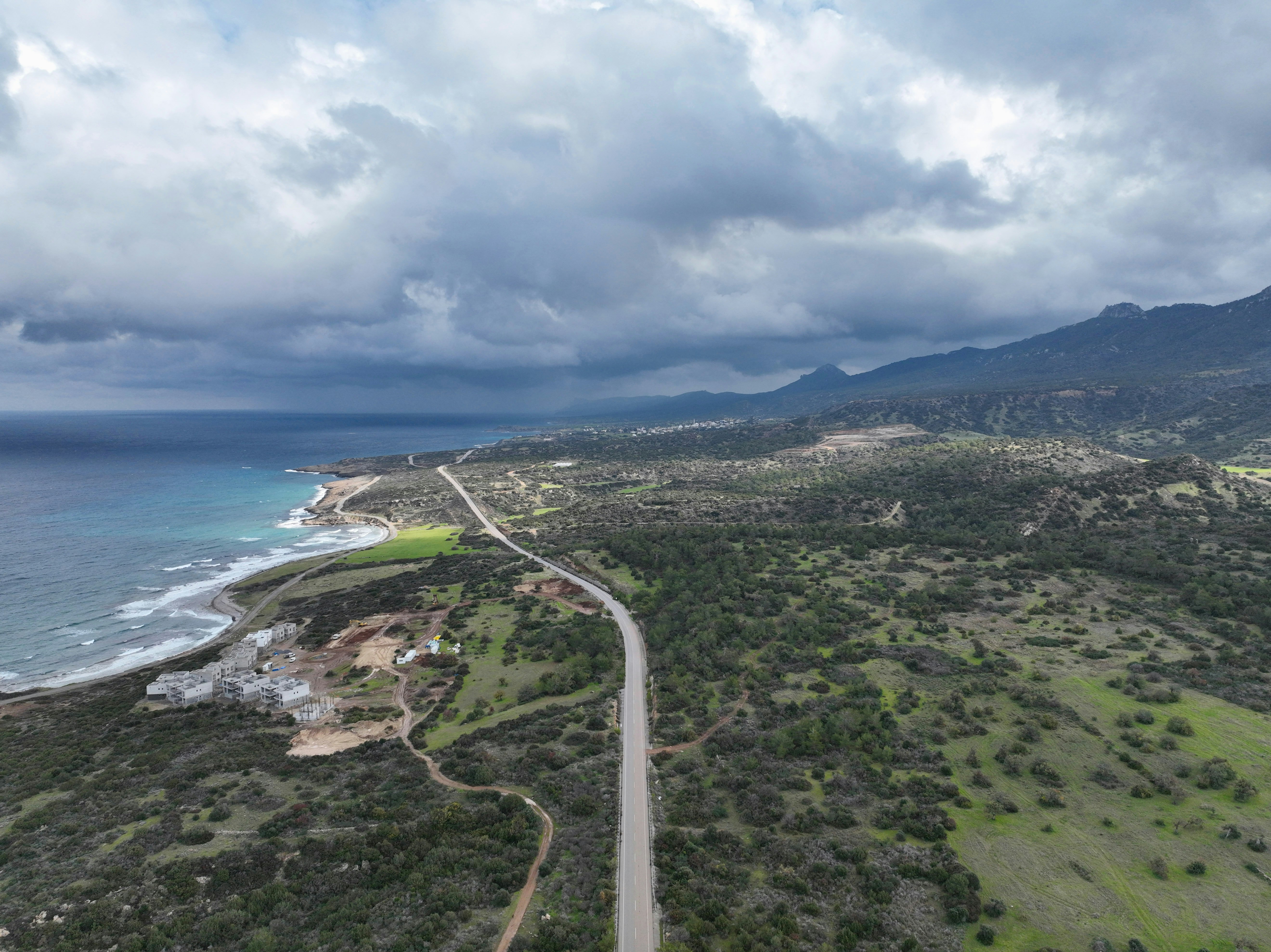 an aerial view of a road near the ocean, A quick plane view of the roads of Balalan Village, Famagusta, Cyprus