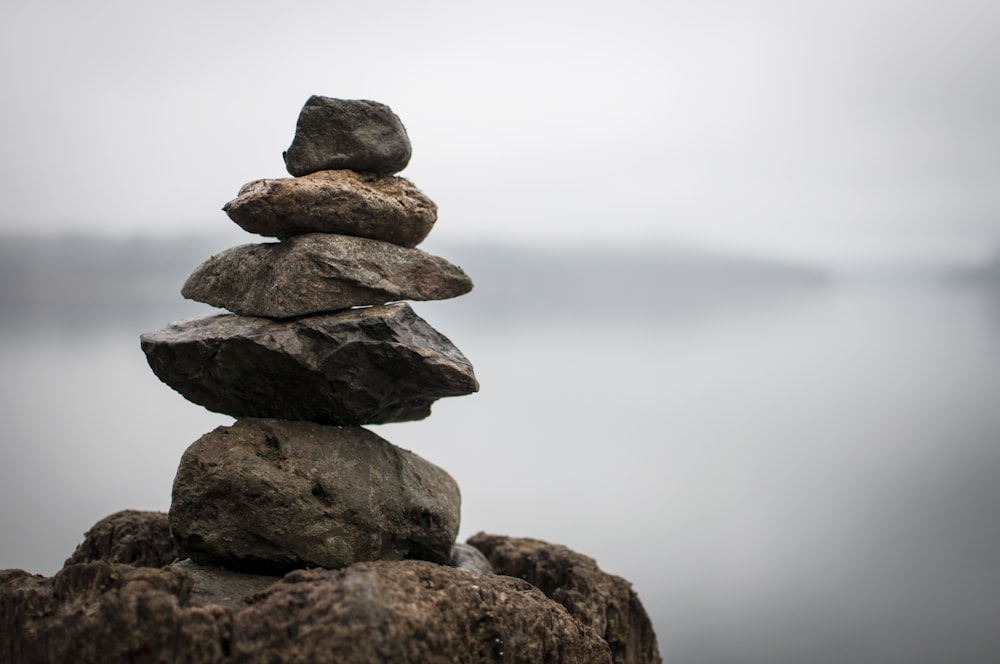 a stack of rocks sitting on top of a rock