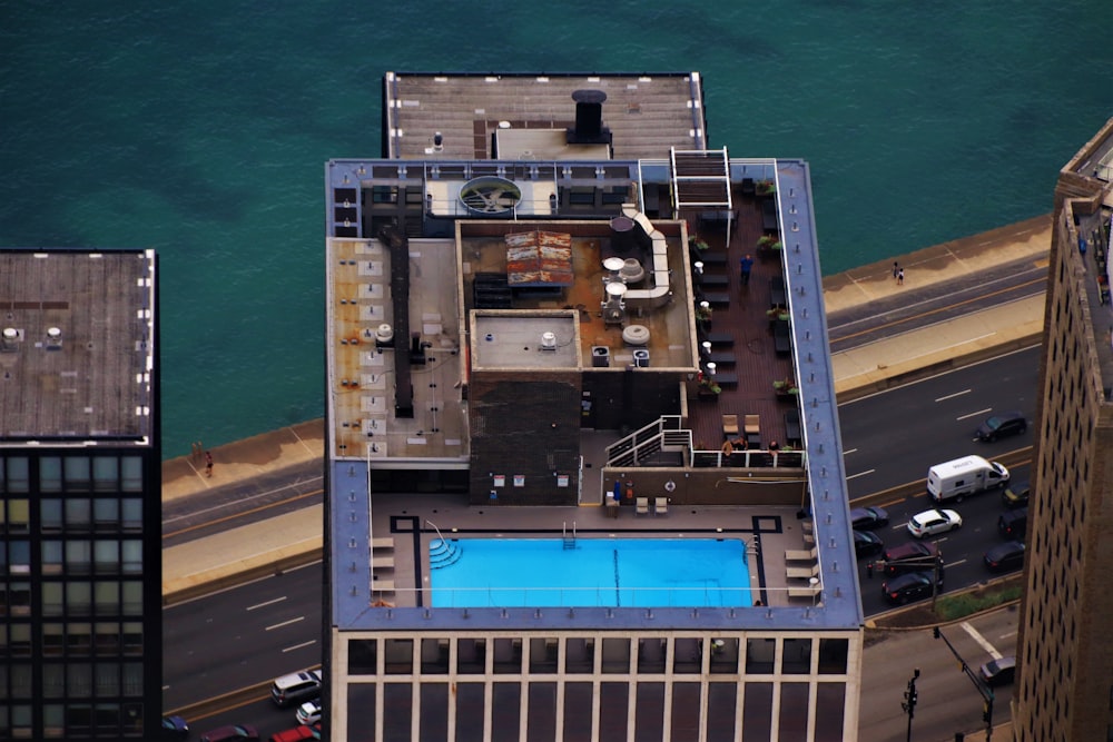 an aerial view of a building with a swimming pool