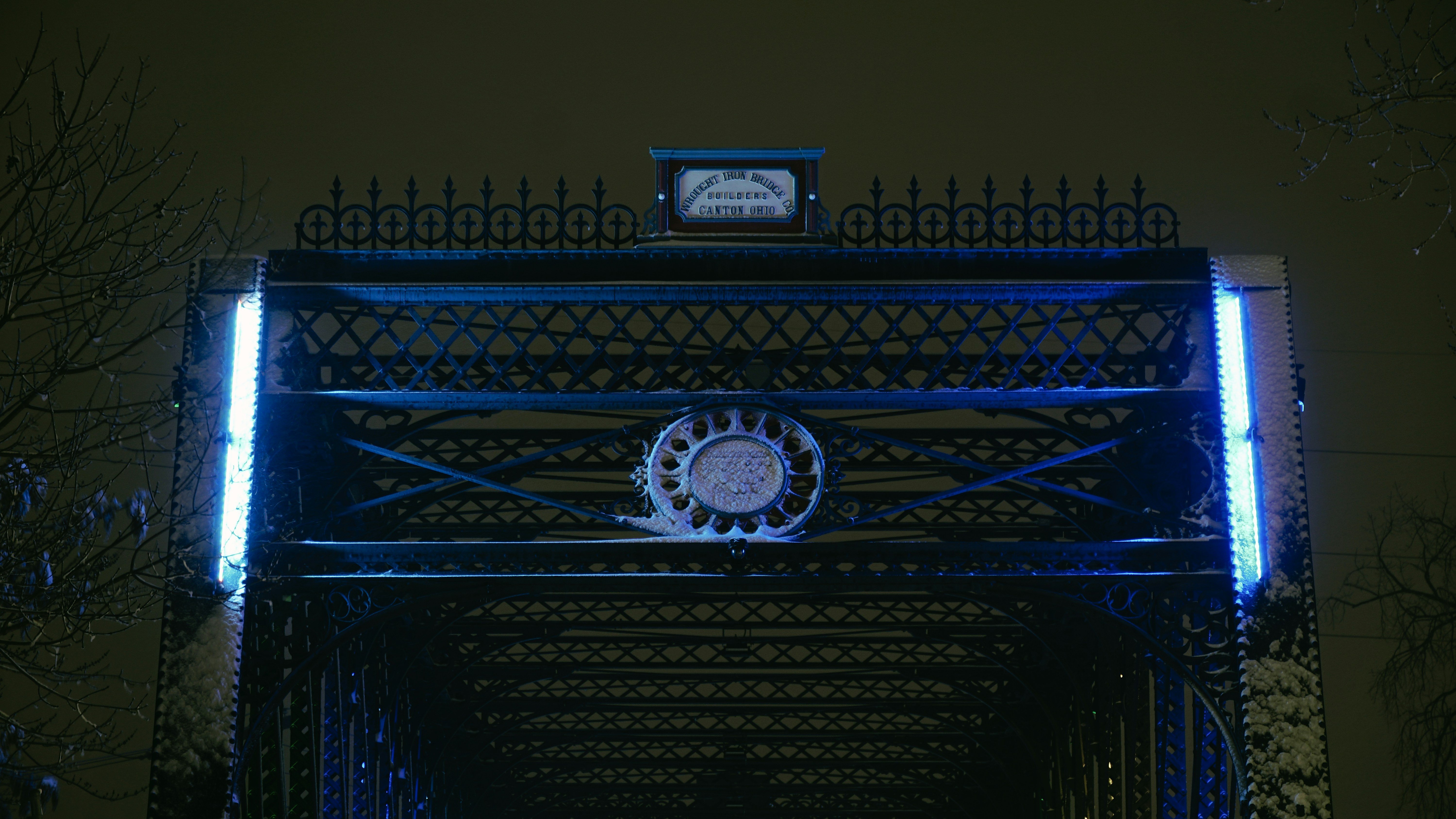a clock that is on top of a bridge