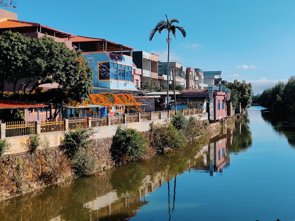 a river running through a city next to tall buildings