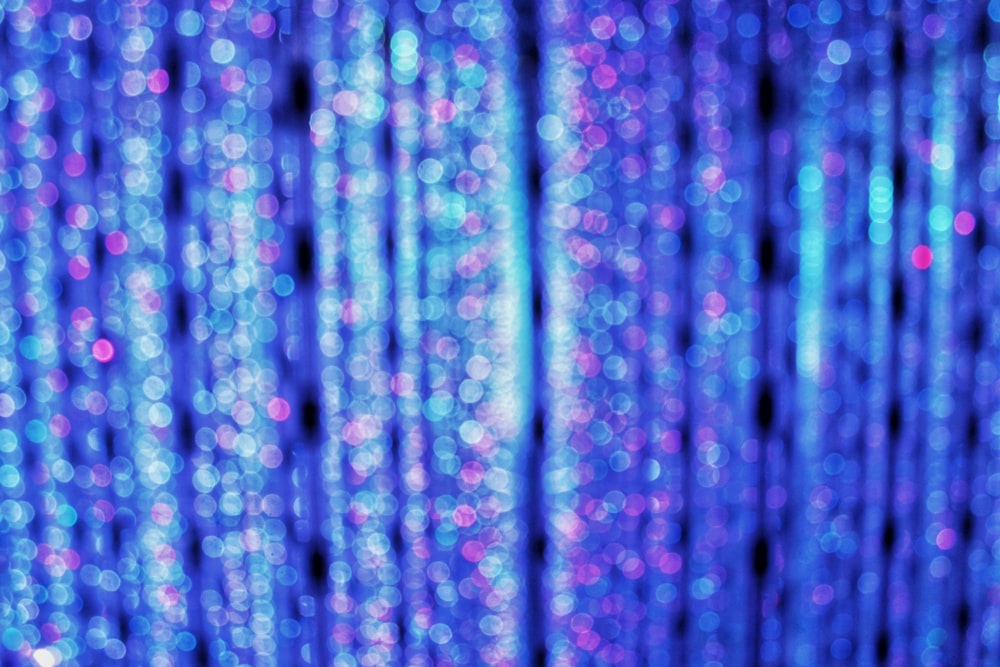 a blurry photo of a blue curtain