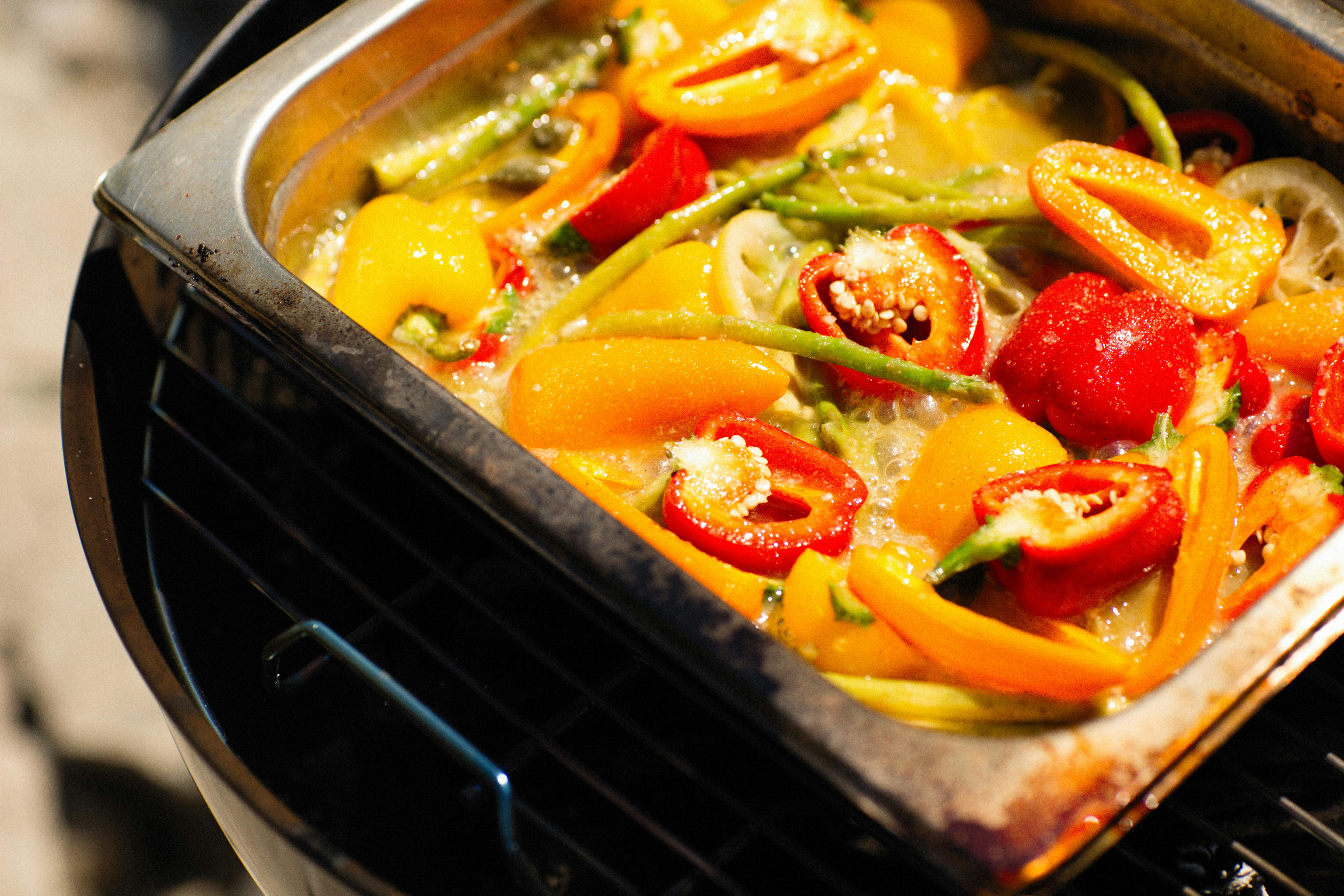 Grilled capsicum and vegetables in a tray