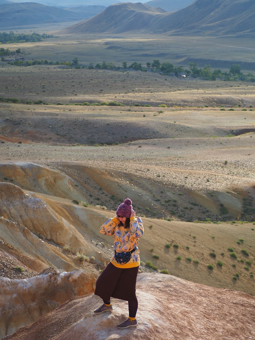 a person standing on top of a rock