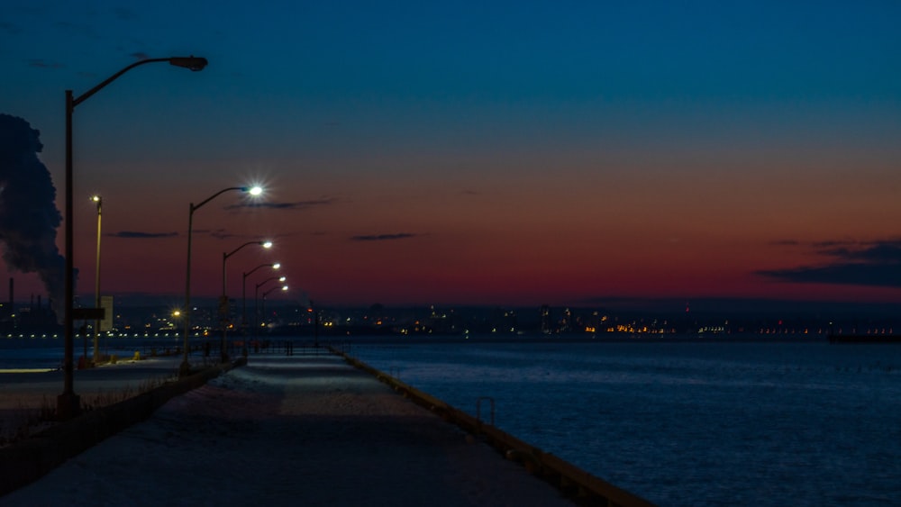 a city street at night with street lights