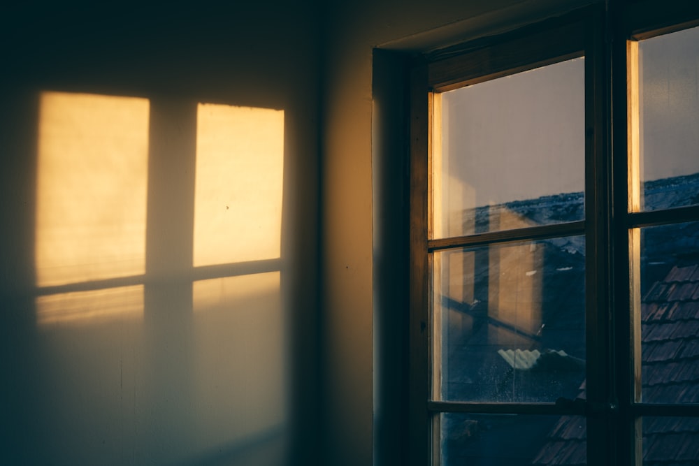 the sun is shining through the windows of a house