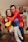 a man and a woman holding a child in their arms