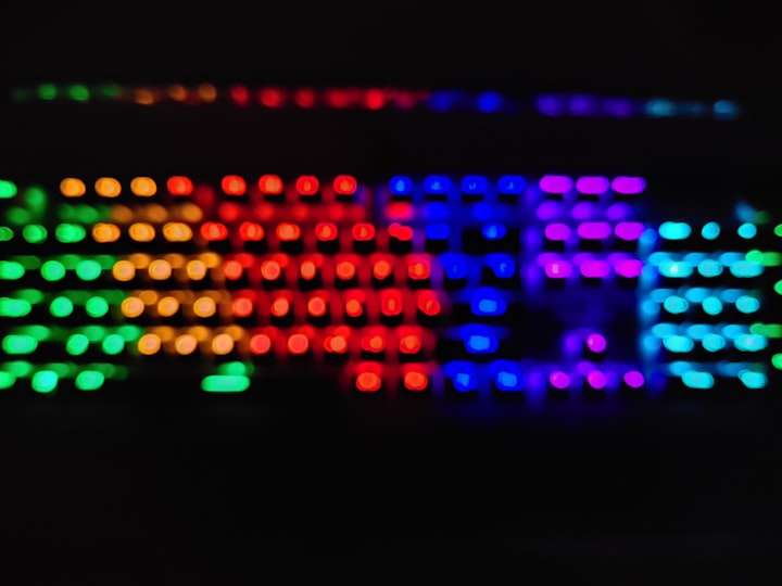A glowing mechanical keyboard photographed in a dark room