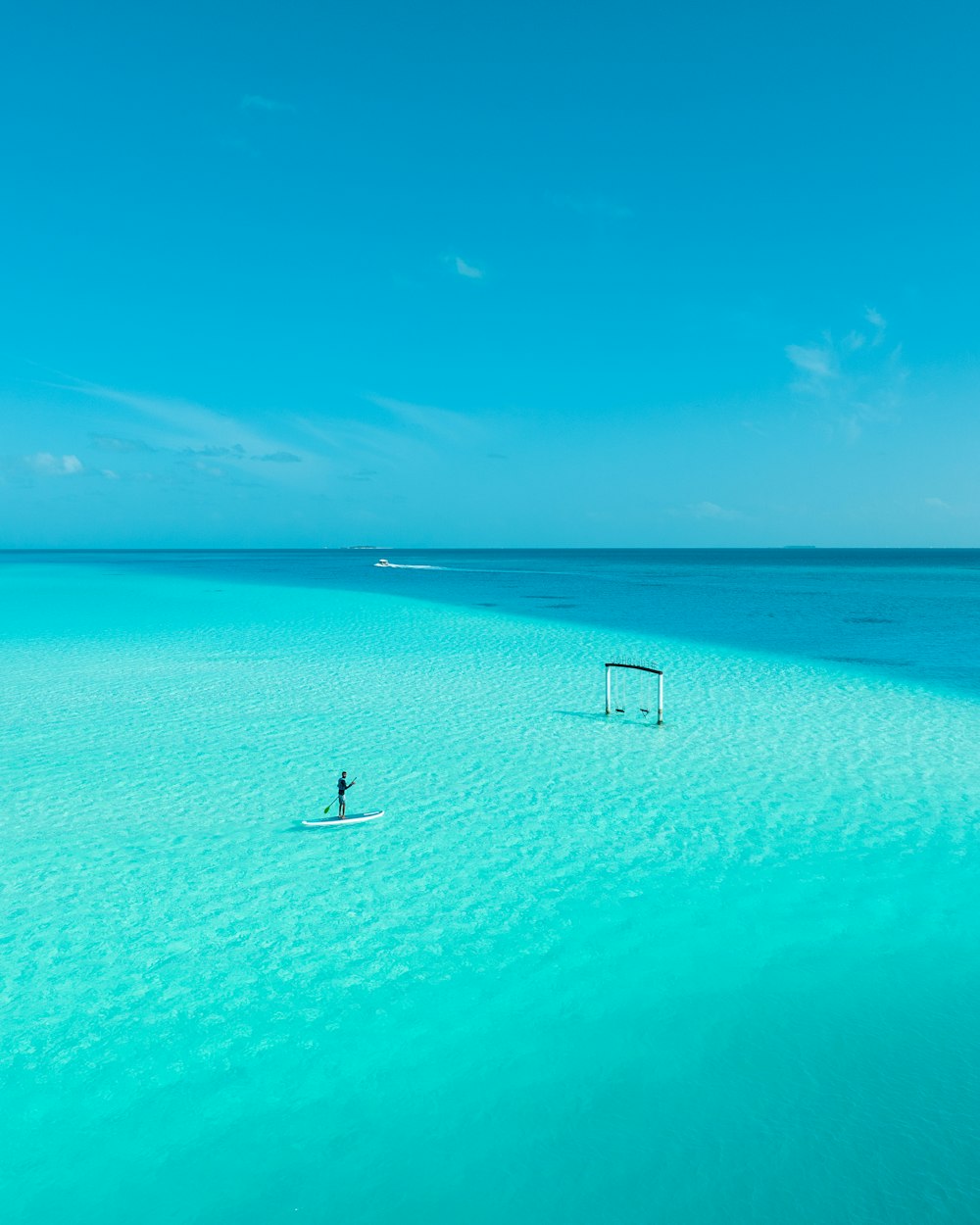 a person on a surfboard in the middle of the ocean