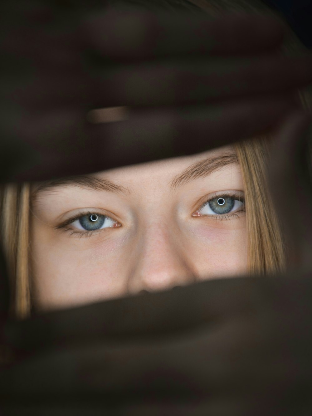 a close up of a person with blue eyes