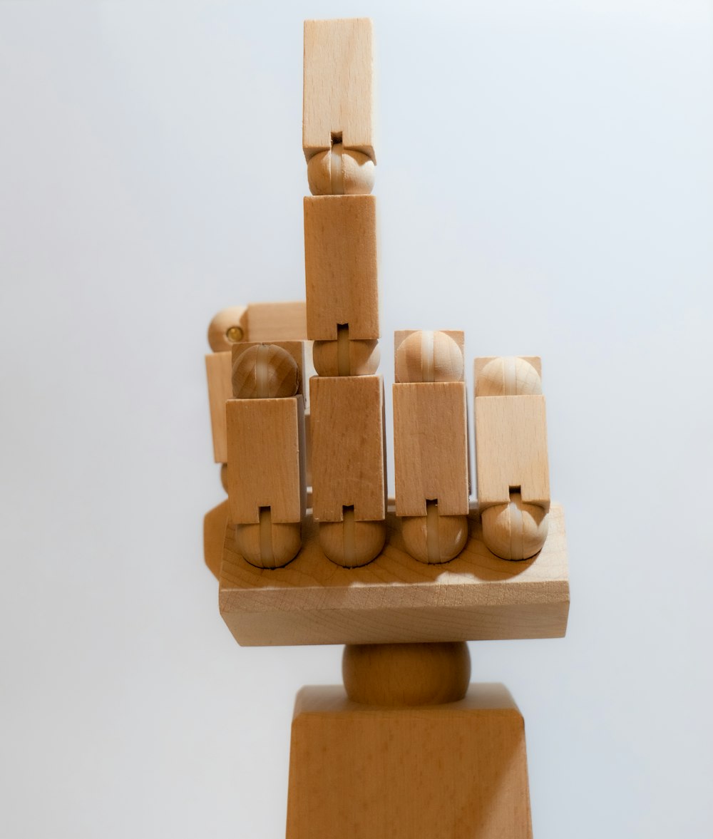 a sculpture made of wooden blocks and balls