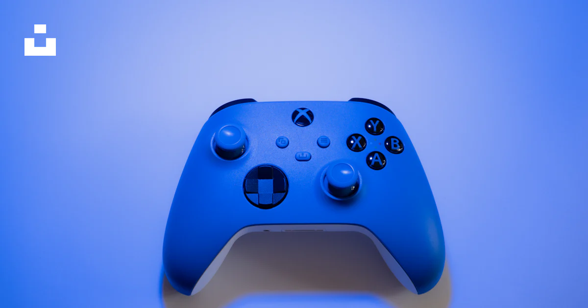 A Close Up Of A Blue Controller On A Blue Background Photo Free Xbox xbox-controller-wallpapers-4k-hd-backgrounds-on-wallpaperbat