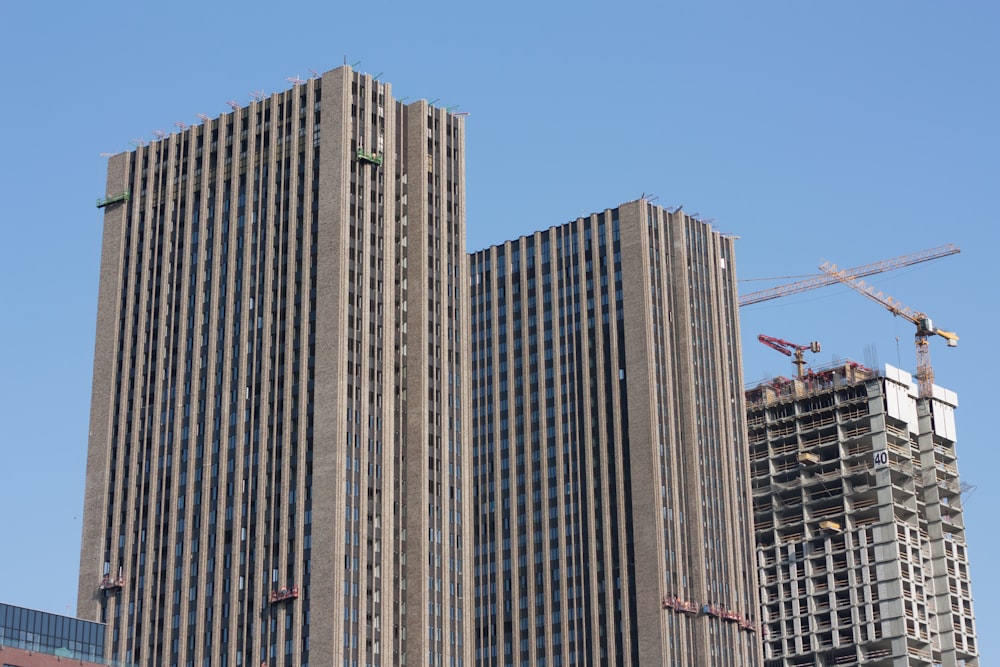 a tall building with a crane on top of it