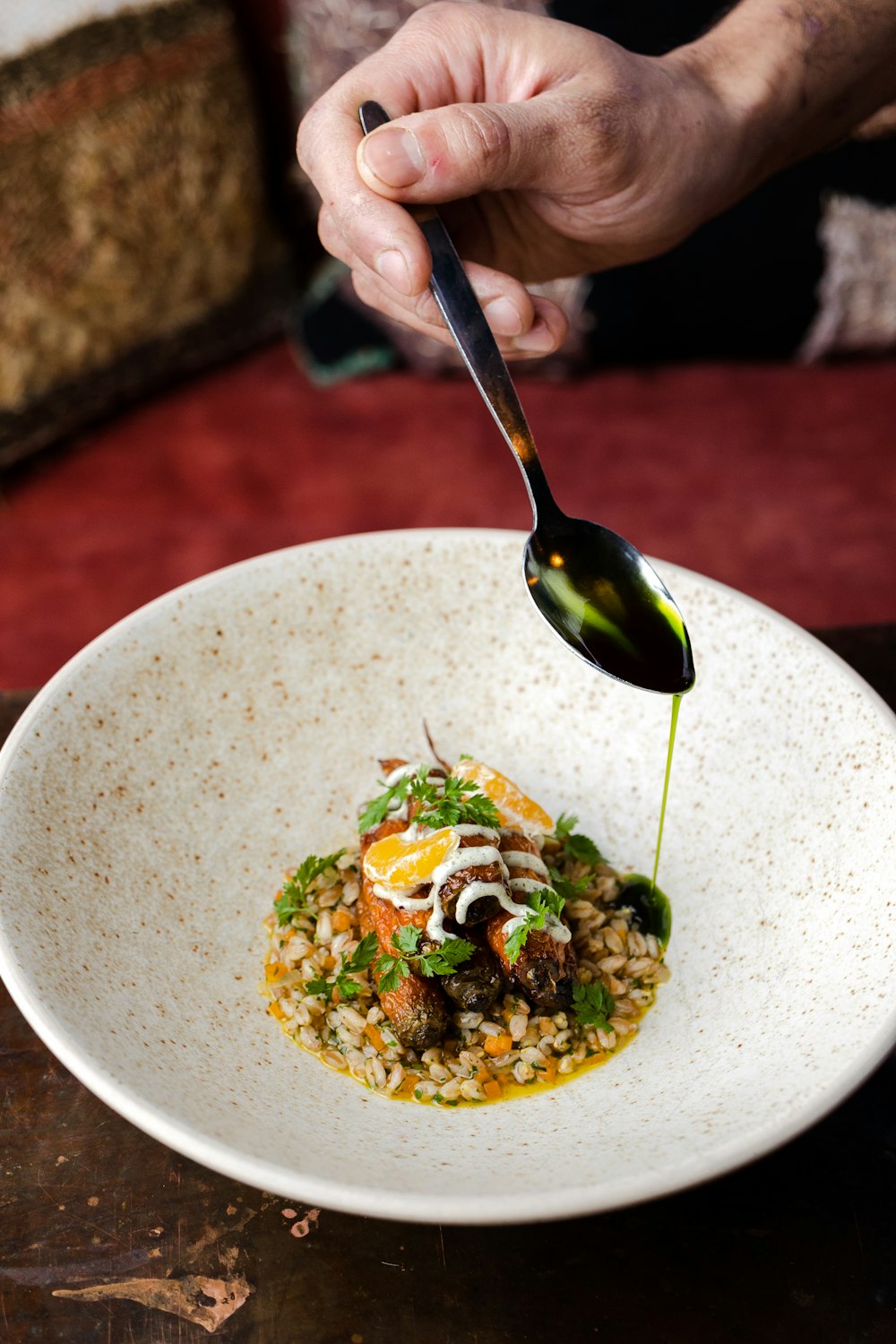 a person is spooning food out of a bowl