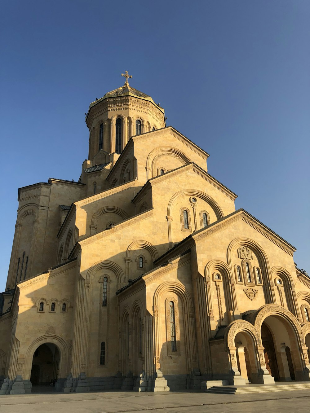 a large church with a cross on top of it