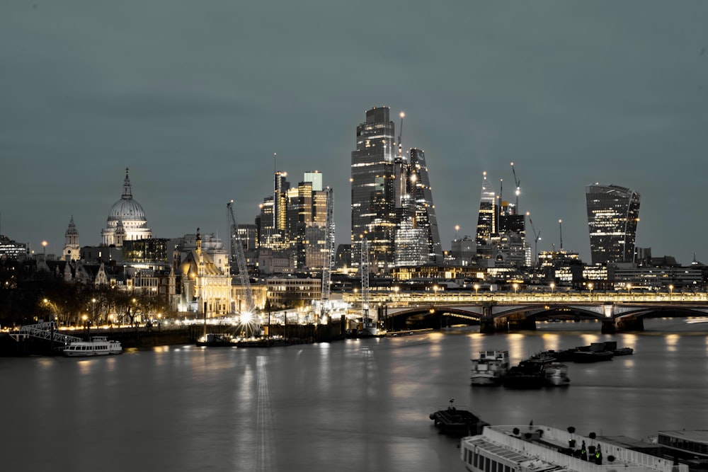 a view of a city at night from across the river