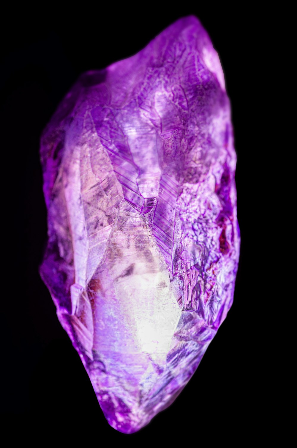 a large purple diamond on a black background