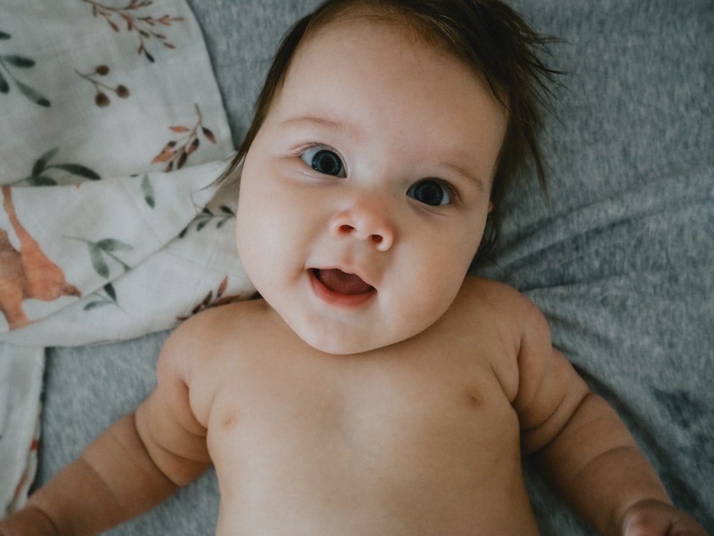 a hand holding a baby