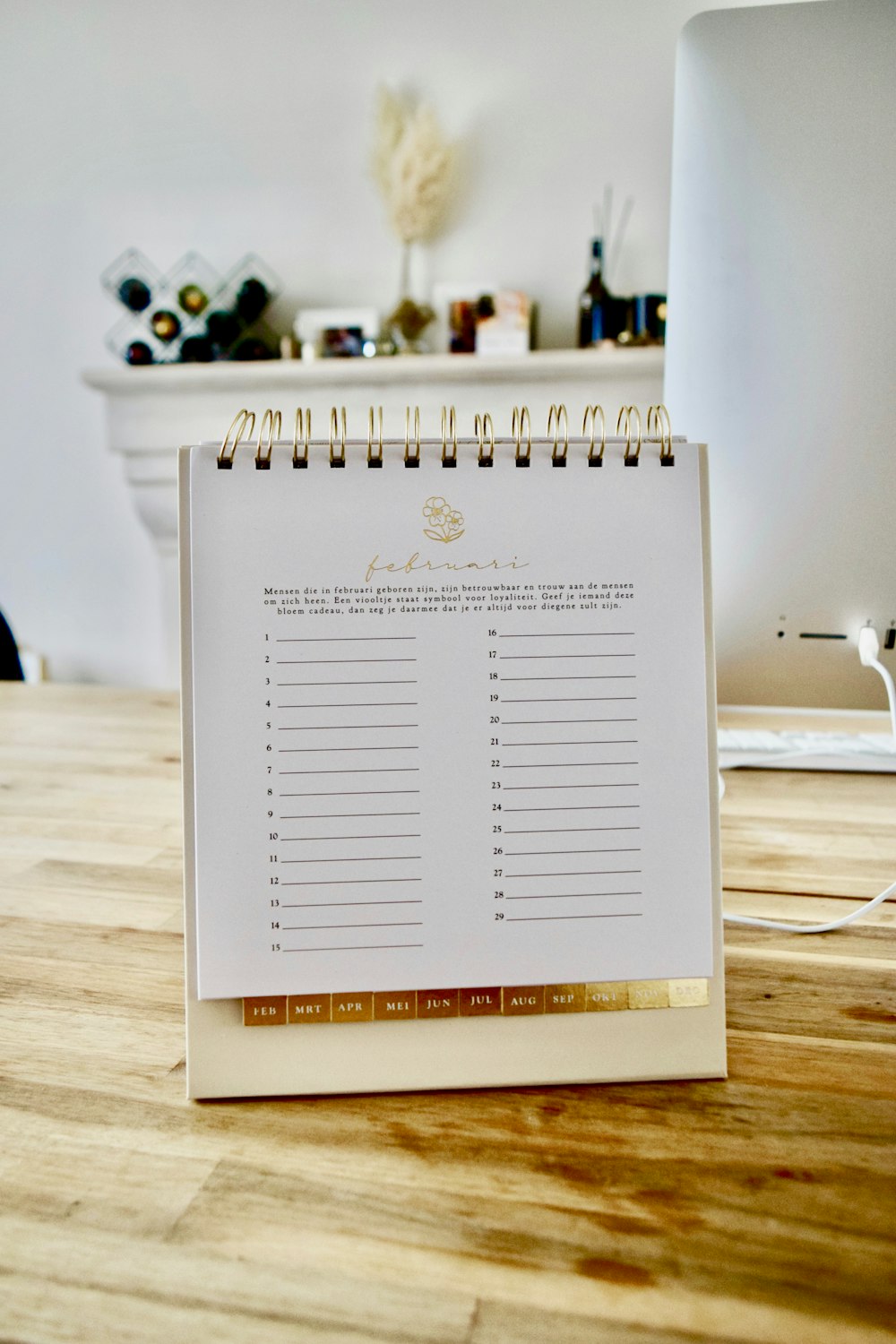 a calendar sitting on top of a wooden table