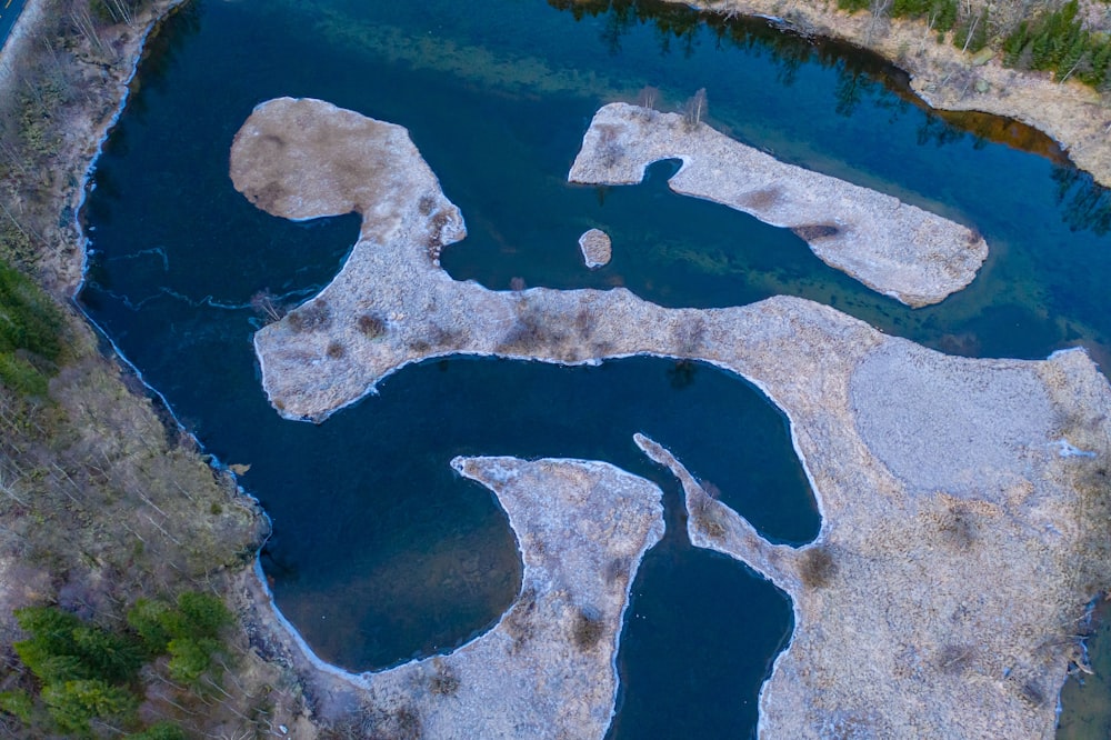 an aerial view of a body of water surrounded by land