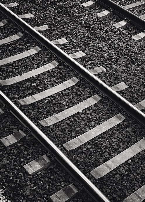 a black and white photo of a train track