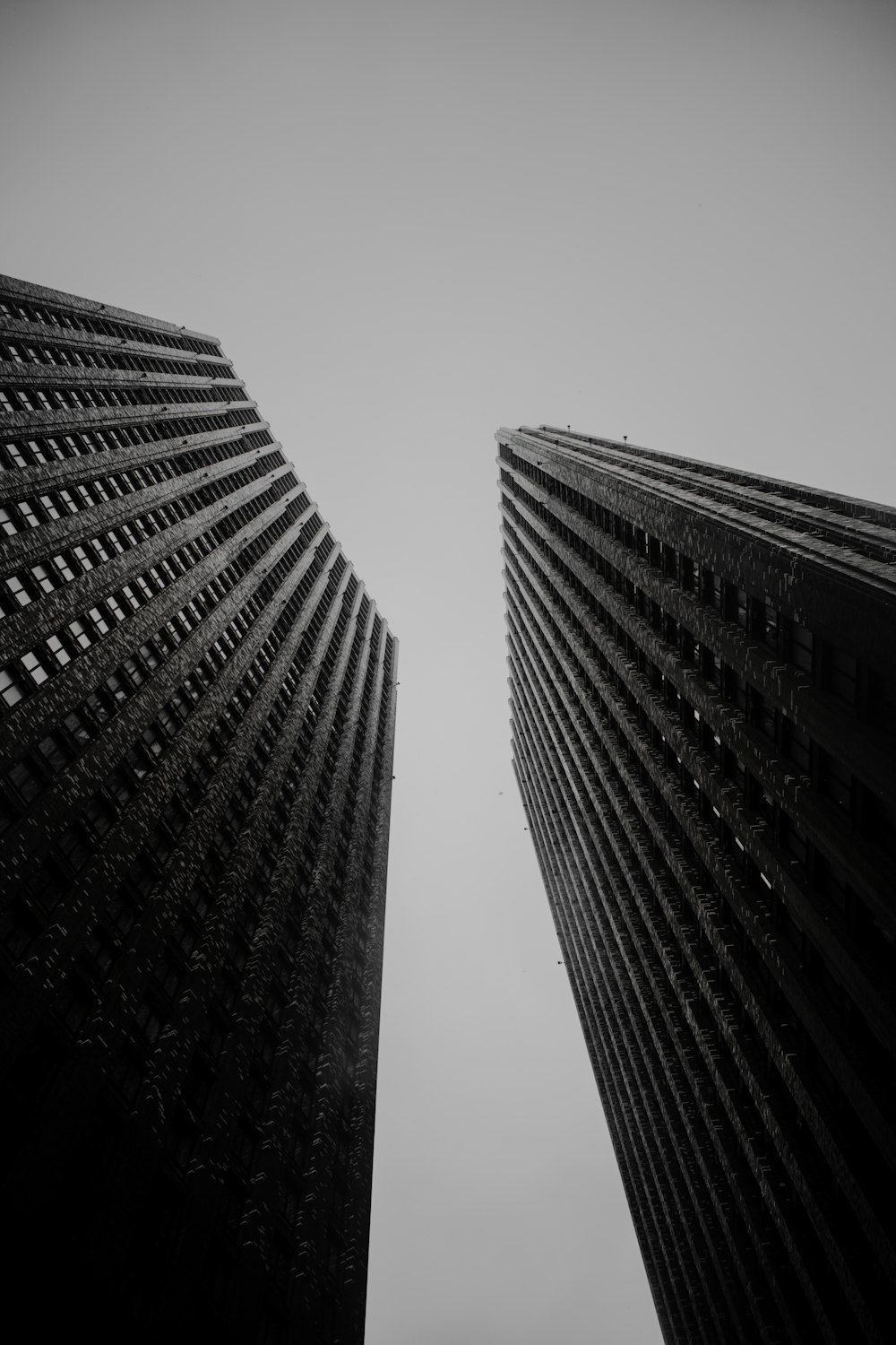 a couple of tall buildings that are next to each other