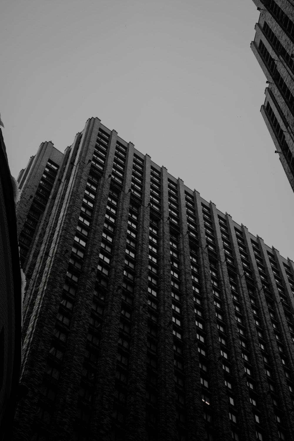 a black and white photo of tall buildings