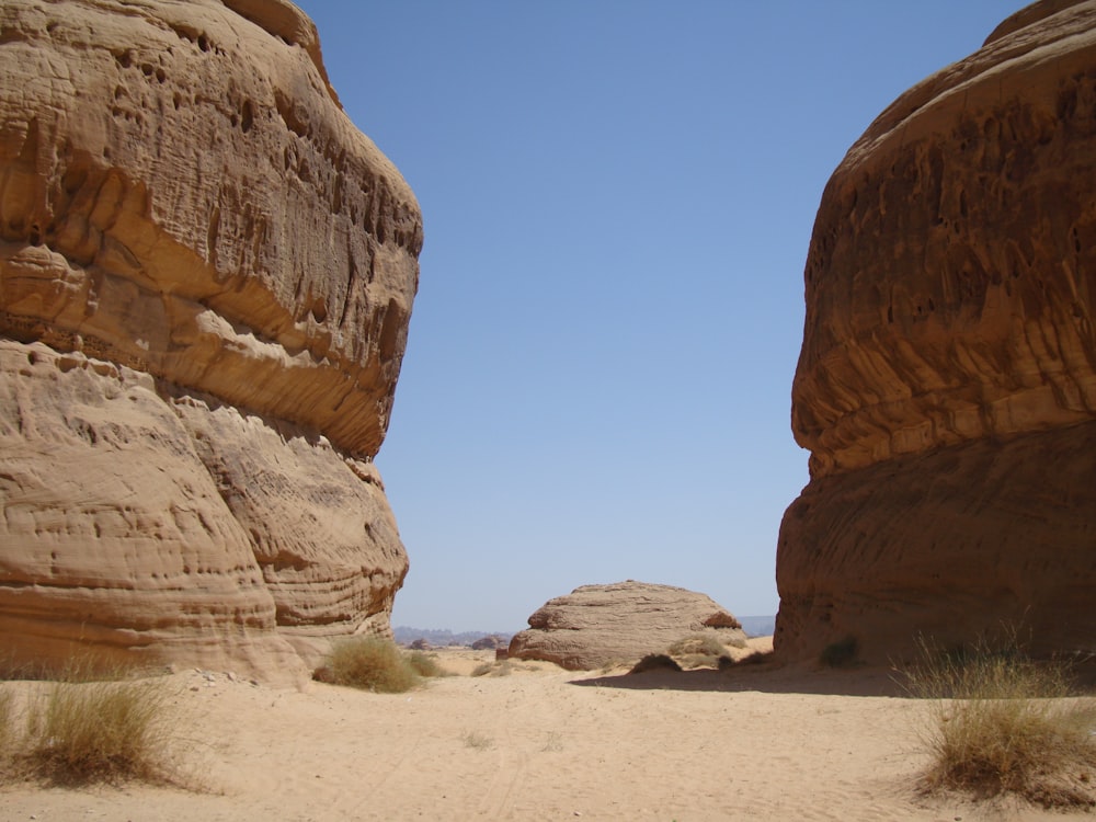 a large rock formation in the middle of a desert