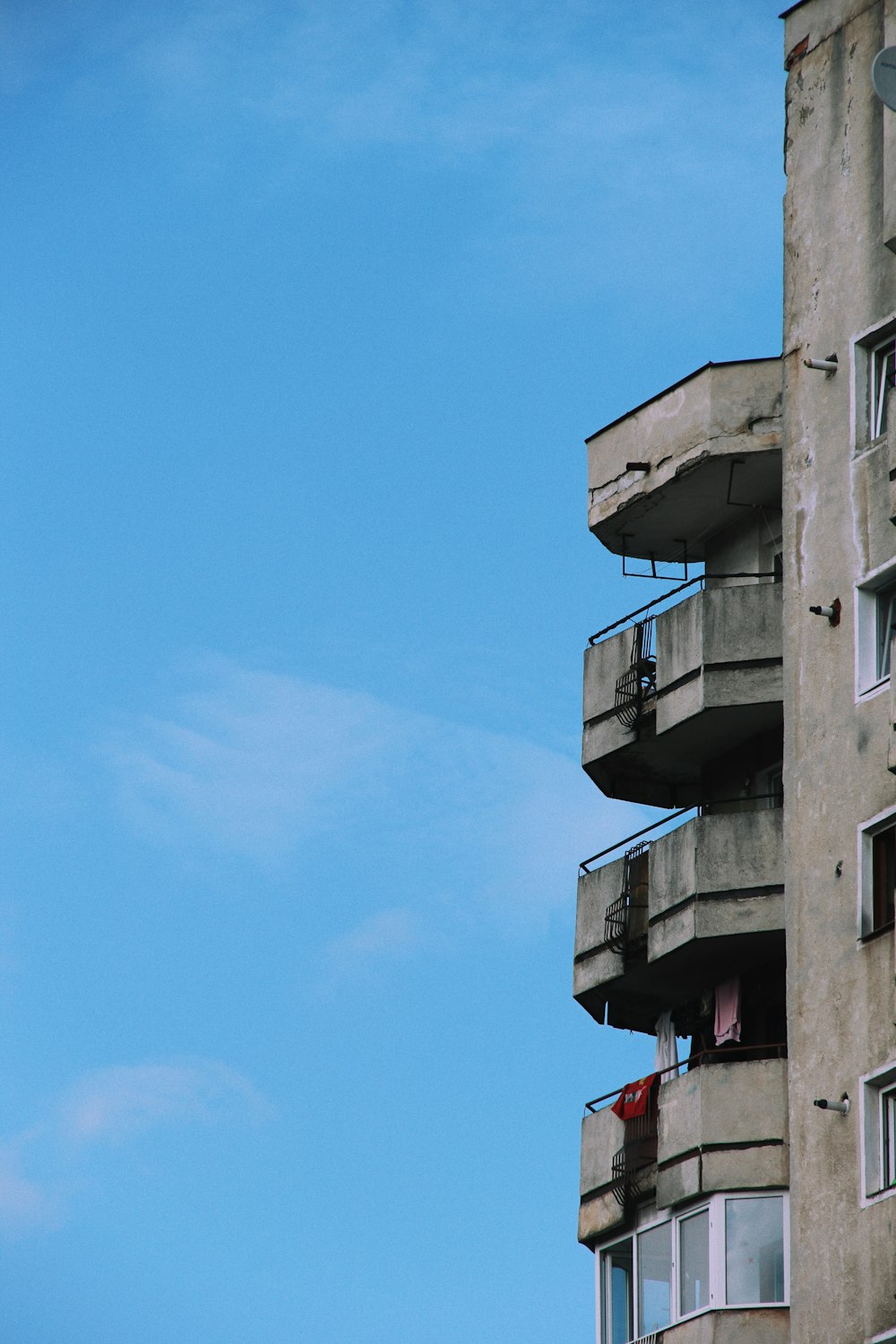 a tall building with balconies and balconies on it