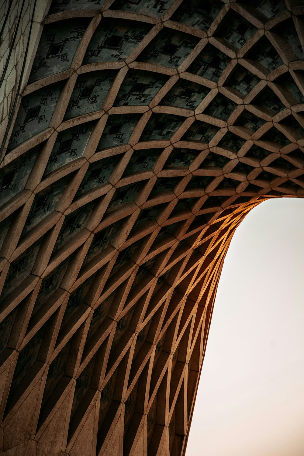 a close up of a building with a sky in the background