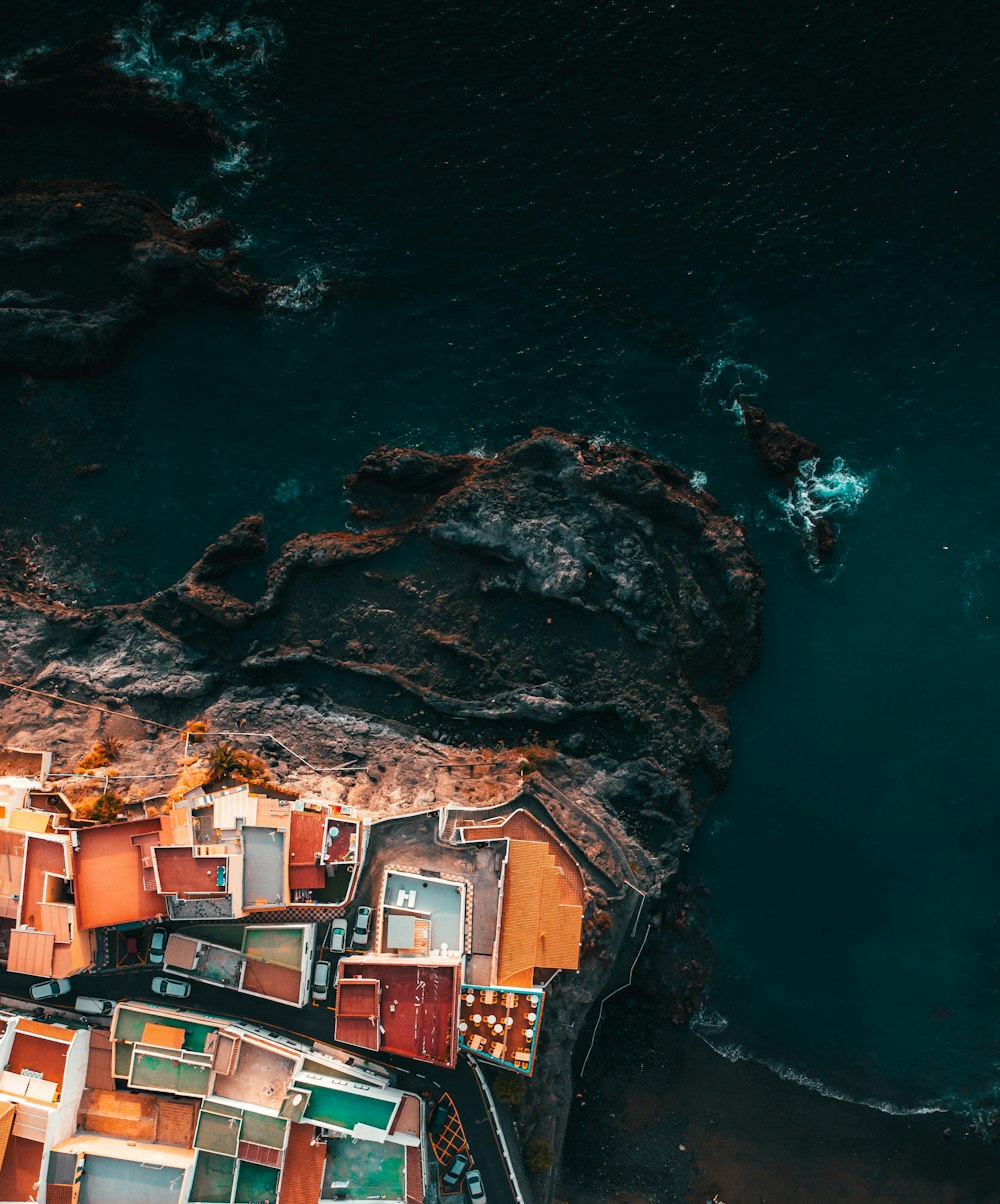 an aerial view of a city by the water