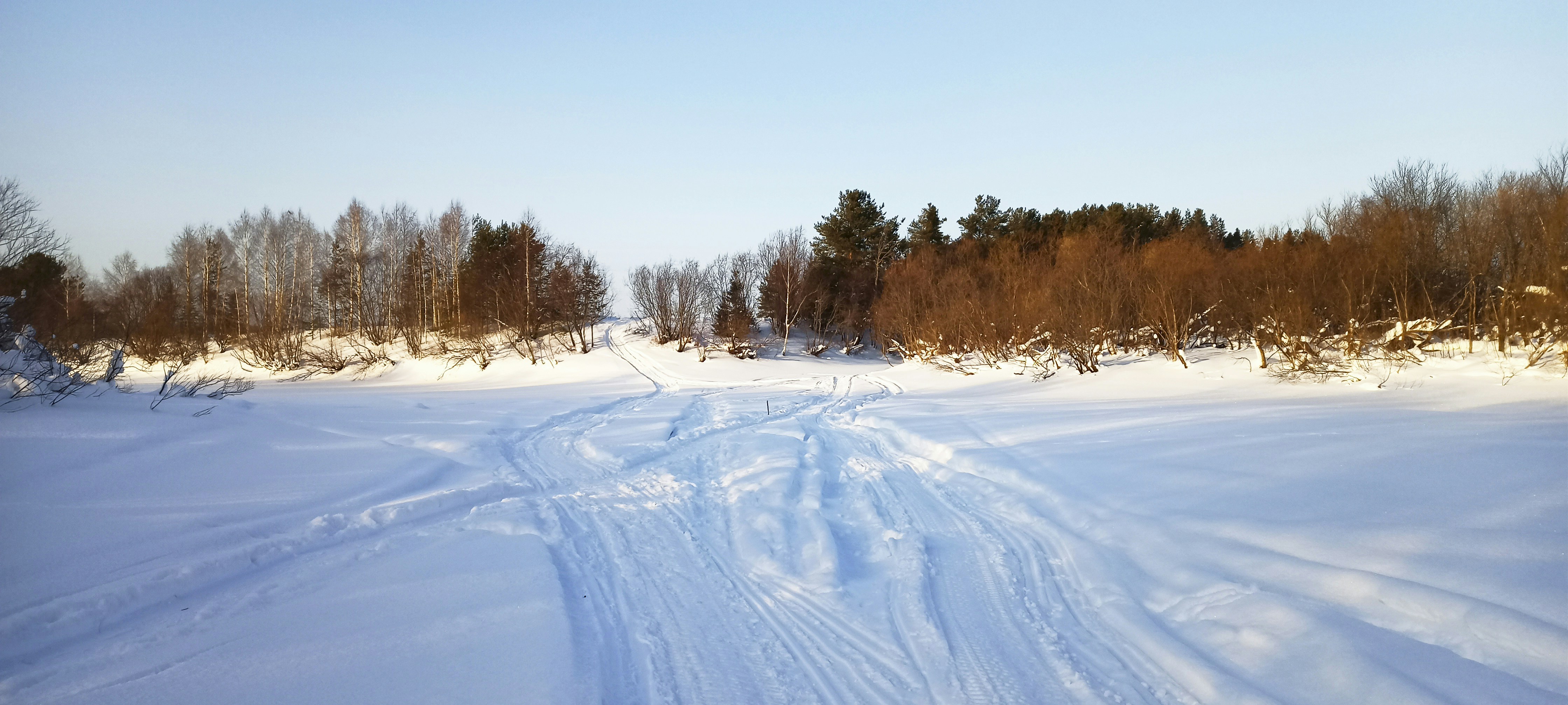 a person riding skis down a snow covered slope