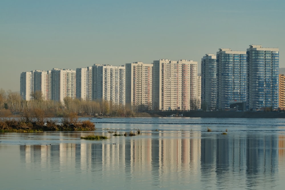 a body of water surrounded by tall buildings