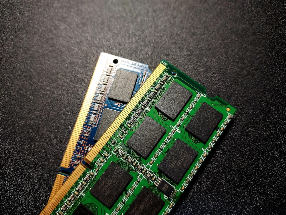 a close up of two memory cards on a table
