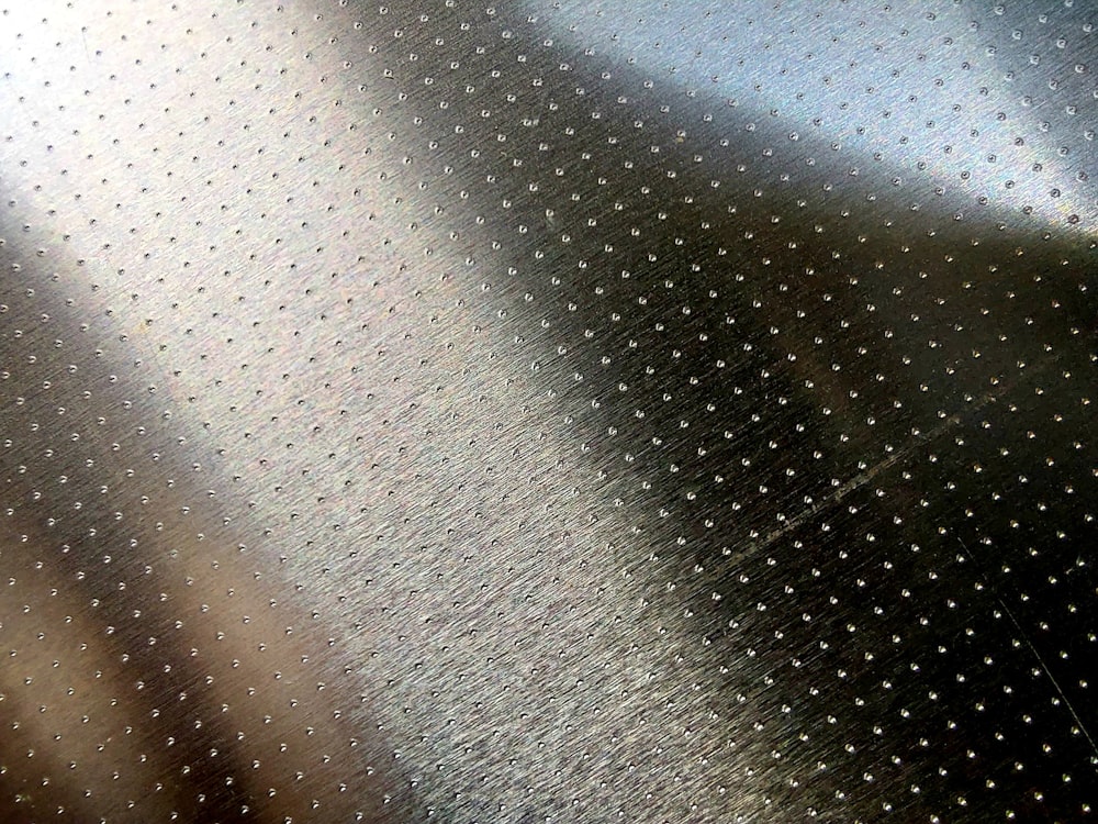 a close up view of a metallic surface