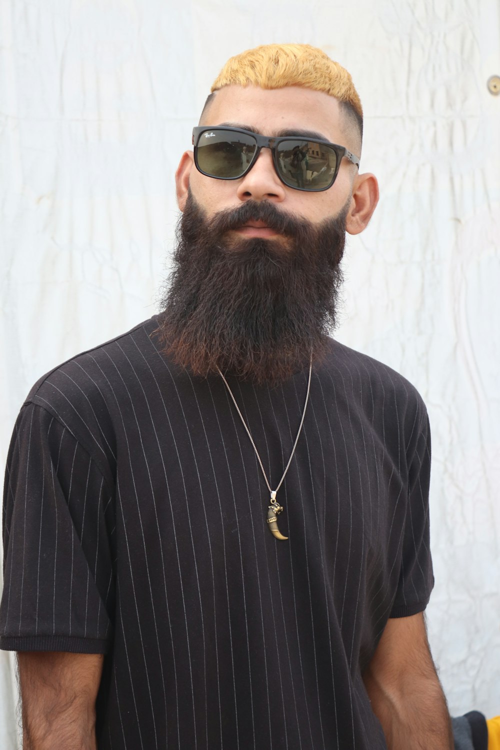 a man with a long beard wearing sunglasses