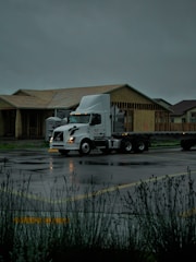 a semi truck parked in a parking lot
