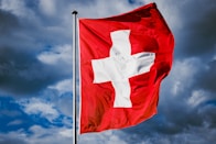 a red and white flag with a white cross on it