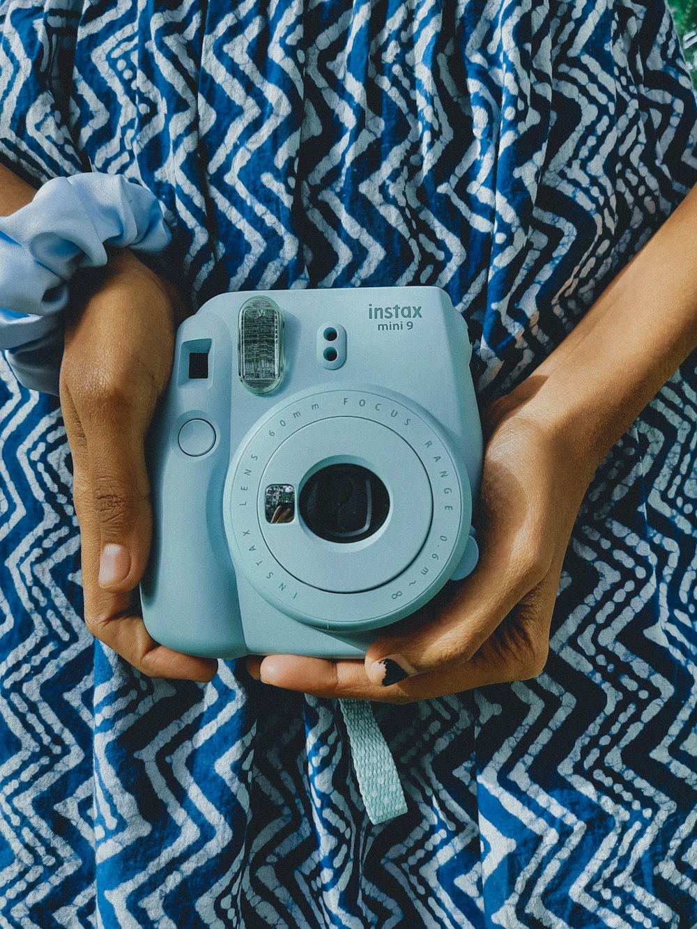 a person holding a camera in their hands