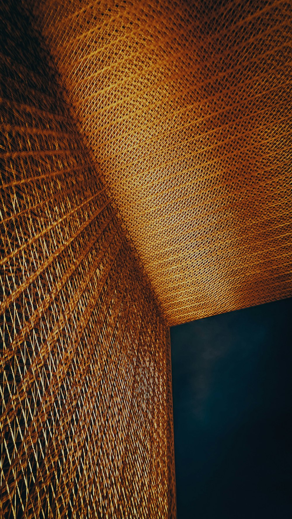 a close up of a metal structure with a sky in the background