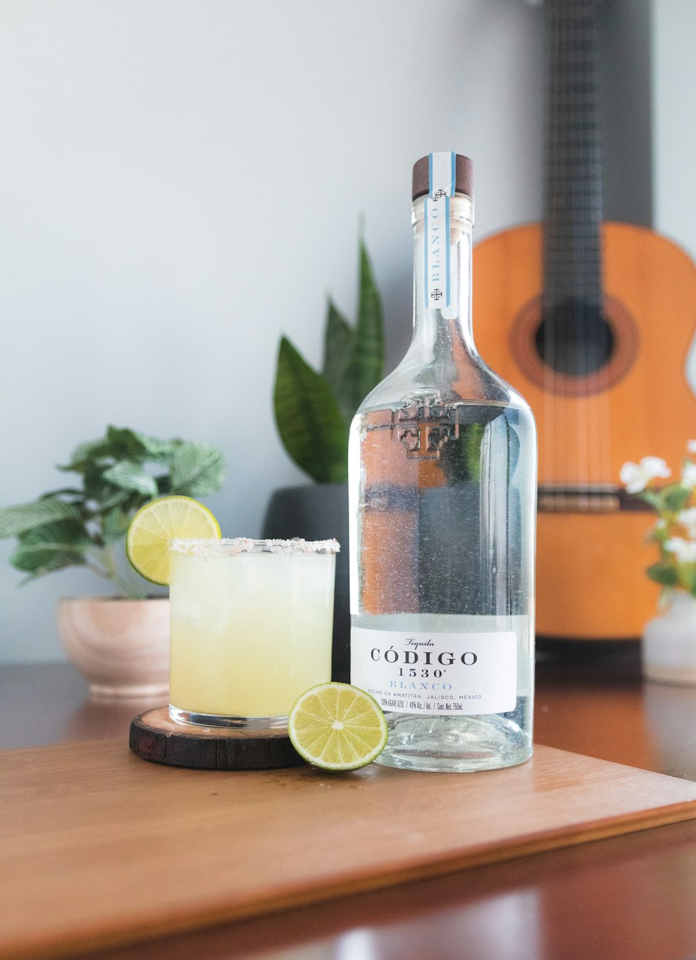 a bottle of alcohol sitting on top of a wooden table