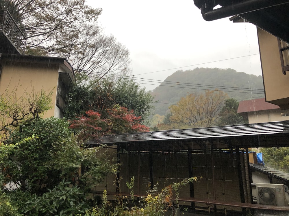 a view of a house with a mountain in the background