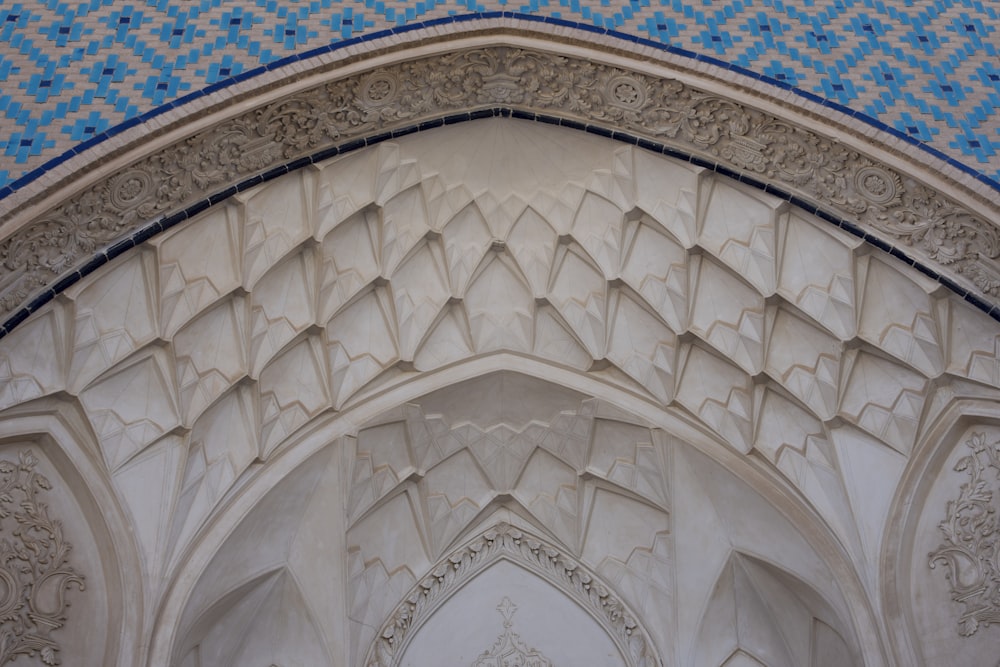 a close up of a building with a blue and white design