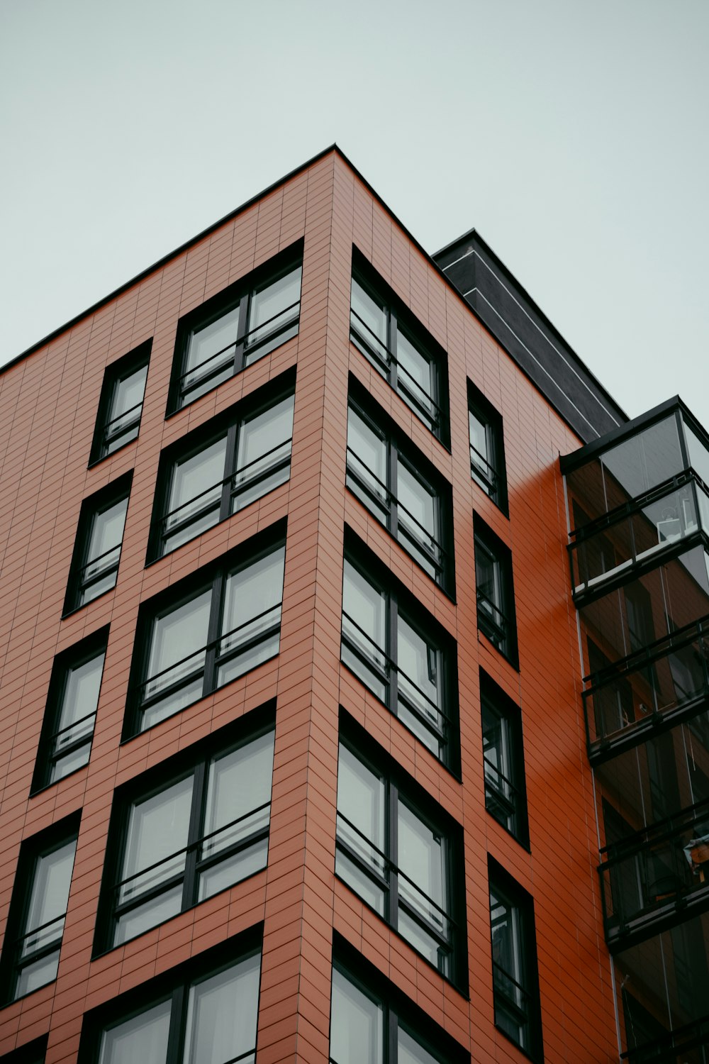 a tall red building with lots of windows