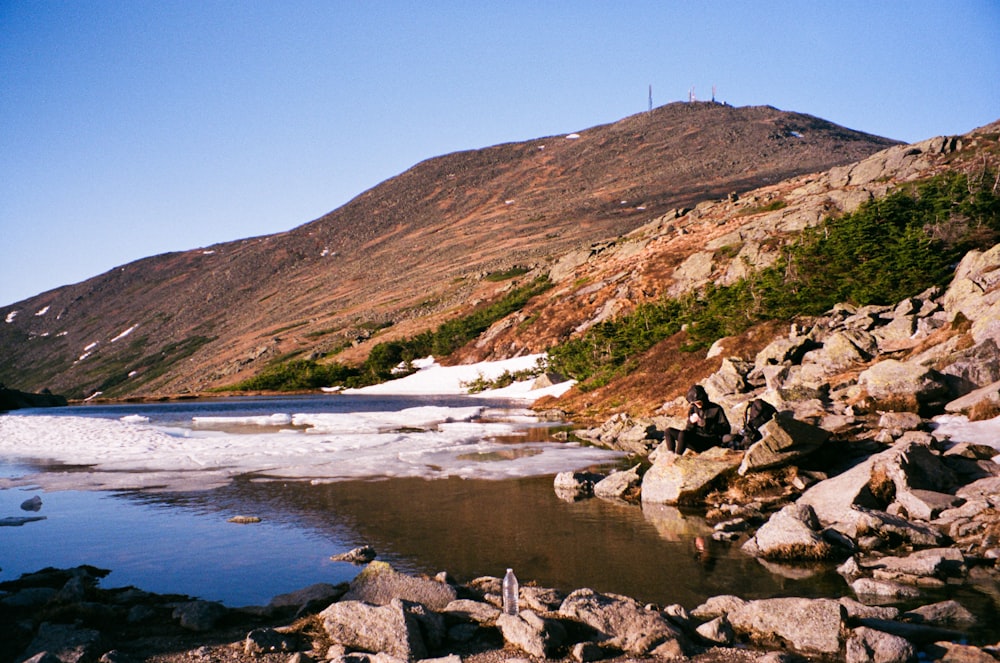 a mountain with a lake in the middle of it