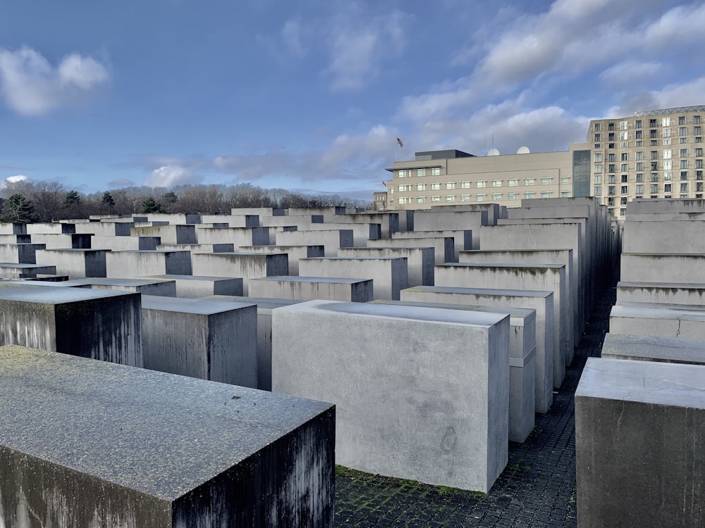 a large group of cement blocks sitting in a field