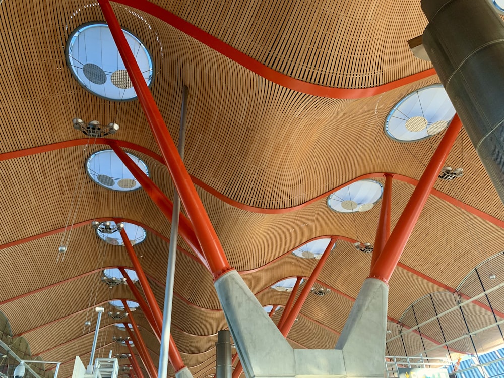 the ceiling of a large building with many round windows