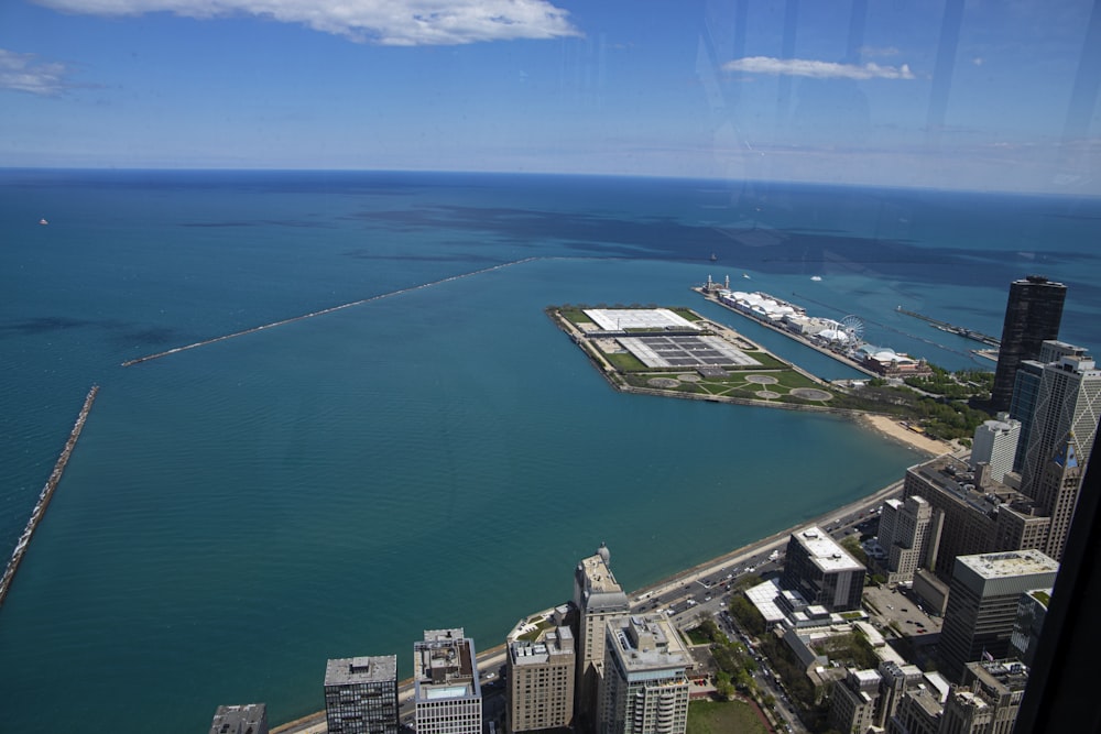 an aerial view of a city and a body of water