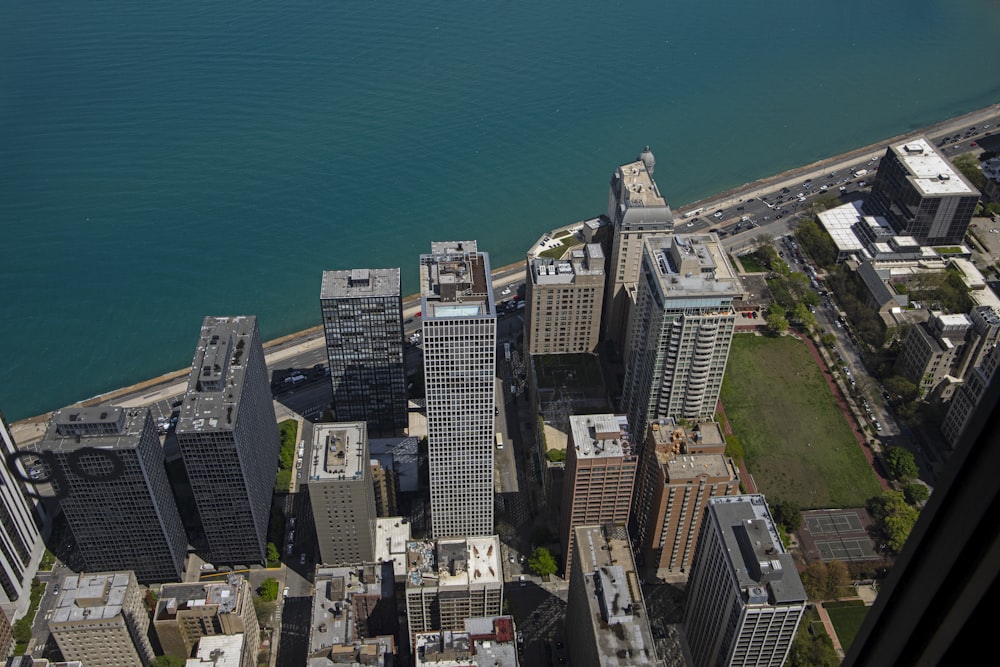 an aerial view of a city and a body of water