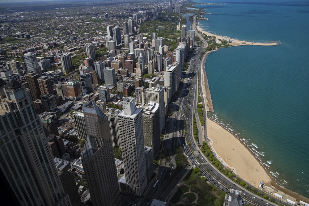 an aerial view of a city and the ocean